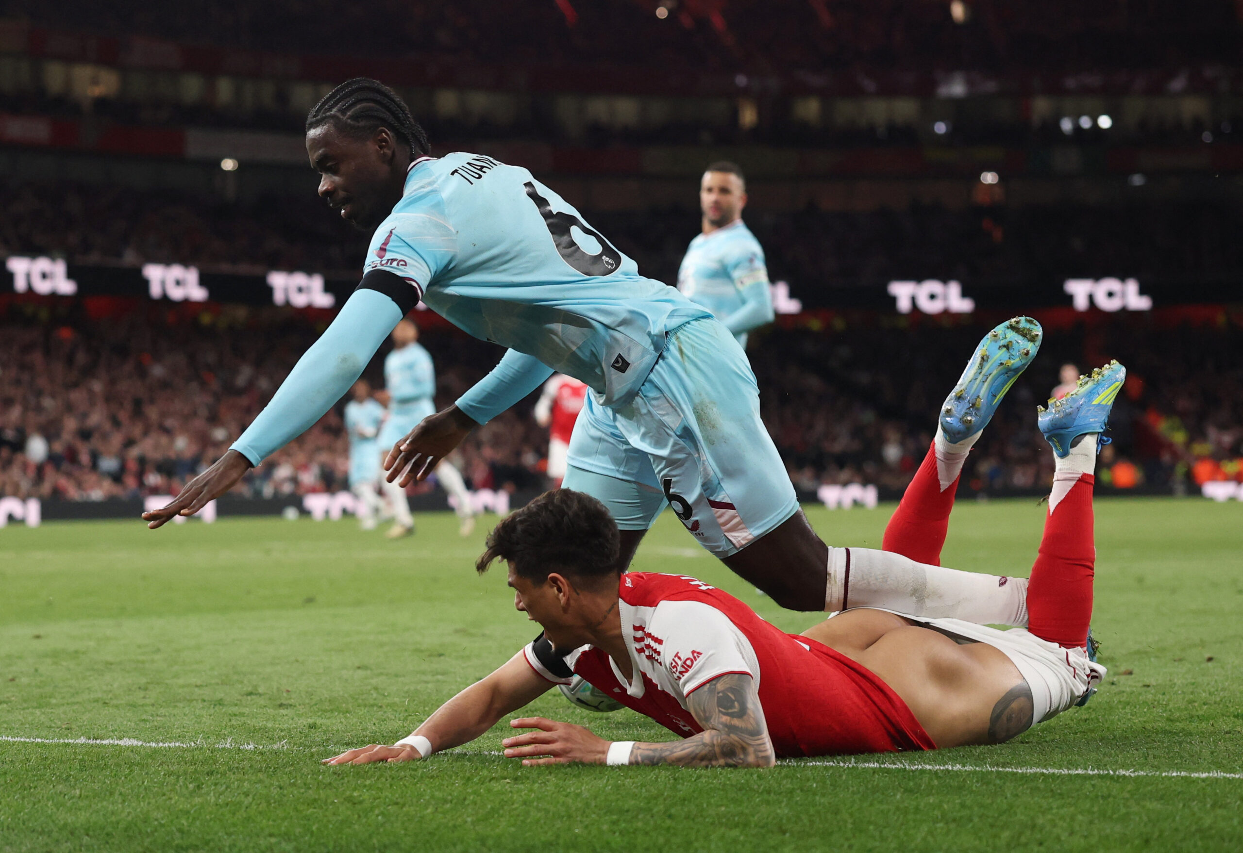 Soccer Football - Premier League - Arsenal v Burnley - Emirates Stadium, London, Britain - May 18, 2026 Burnley's Axel Tuanzebe in action with Arsenal's Piero Hincapie REUTERS