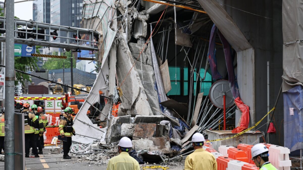 South Korean rescue team inspect the scene where an overpass collapsed while it was being dismantled in Seoul, South Korea, Tuesday, May 26, 2026. (Kim In-chul/Yonhap via AP)