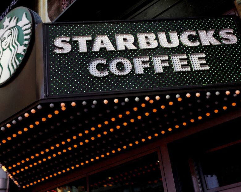 FILE PHOTO: FILE PHOTO: A Starbucks store entrance sign is seen at Times Square in New York City, U.S., February 25, 2025. REUTERS/Shannon Stapleton/File Photo/File Photo