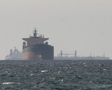 FILE PHOTO: Cargo ships in the Gulf, near the Strait of Hormuz, as seen from northern Ras al-Khaimah, near the border with Oman’s Musandam governance, amid the U.S.-Israeli conflict with Iran, in United Arab Emirates, March 11, 2026. REUTERS/Stringer/File Photo/File Photo