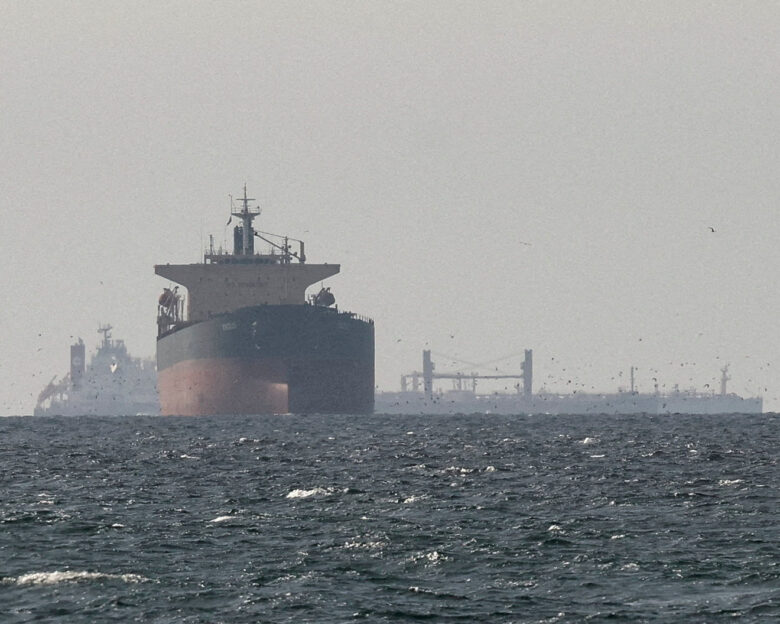 FILE PHOTO: Cargo ships in the Gulf, near the Strait of Hormuz, as seen from northern Ras al-Khaimah, near the border with Oman’s Musandam governance, amid the U.S.-Israeli conflict with Iran, in United Arab Emirates, March 11, 2026. REUTERS/Stringer/File Photo/File Photo
