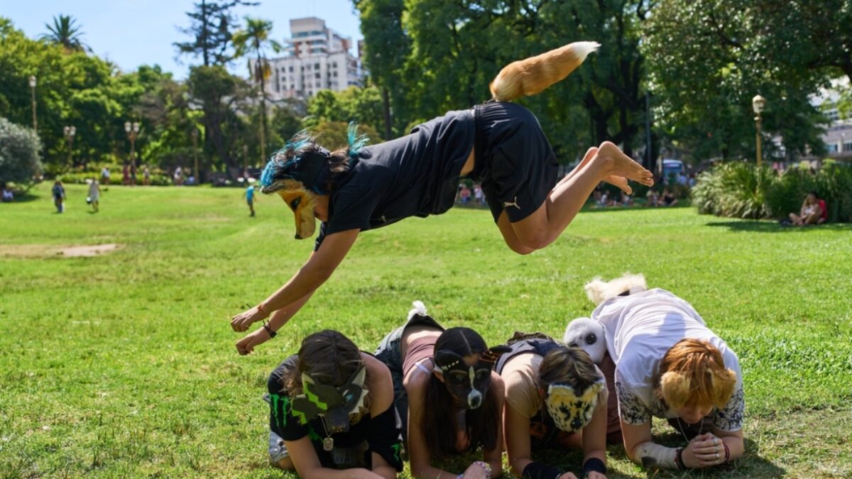 FILE - A youth jumps over other therians, people who say they identify as non-human animals, during a gathering in a square in Buenos Aires, Argentina, Feb. 22, 2026.
