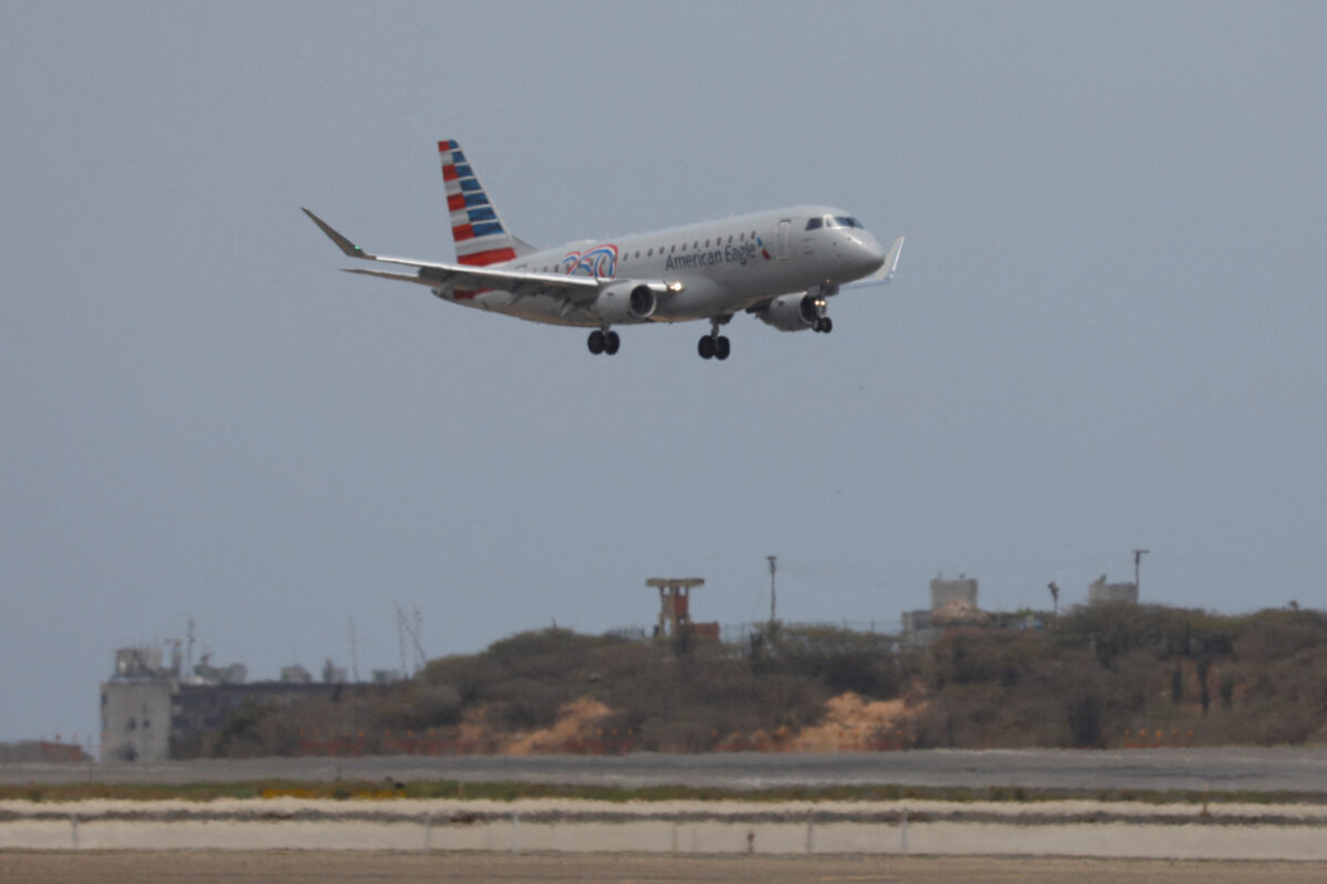An American Airlines flight from Miami lands at Simon Bolivar International Airport