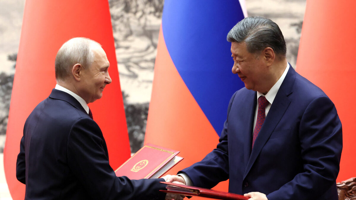 Russian President Vladimir Putin and Chinese President Xi Jinping shake hands during a signing ceremony at the Great Hall of the People in Beijing, China May 20, 2026.