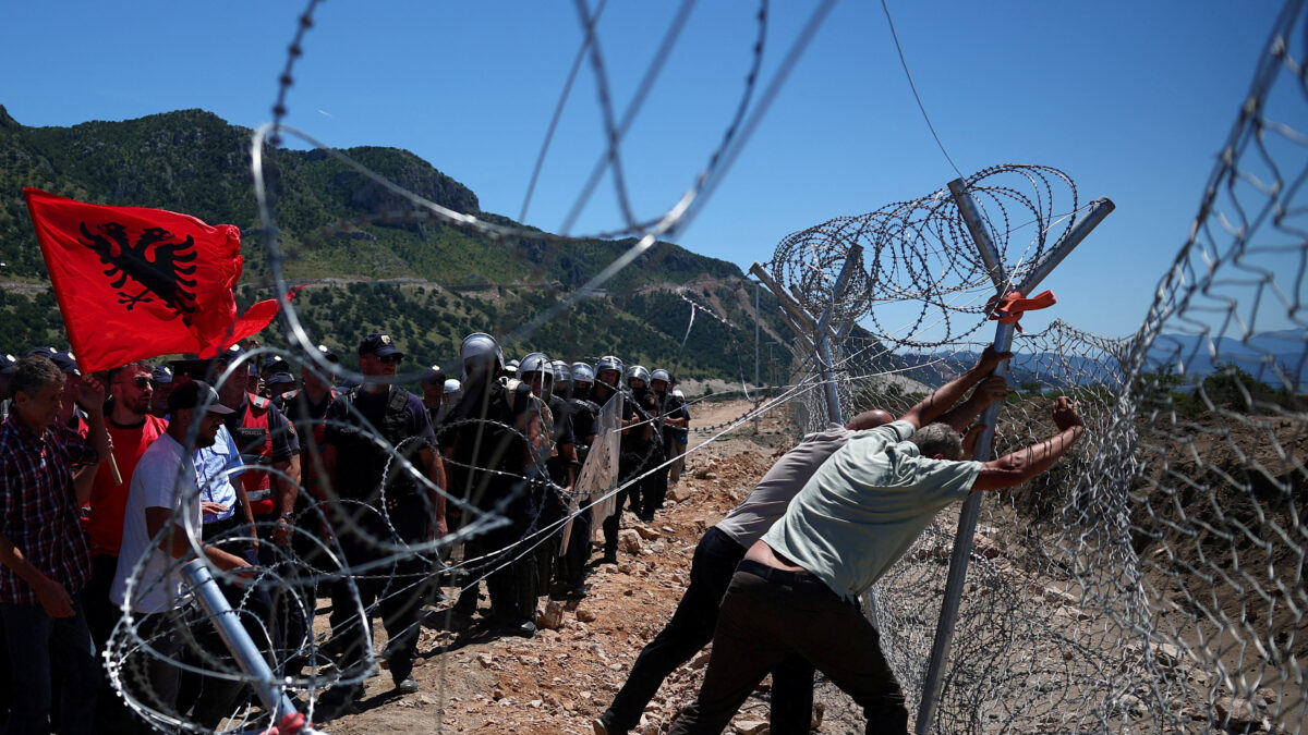 Protesters who say their land has been taken unjustly, tear down the fence where a tourist resort is to be built by the Adriatic coast, in Rrjoll, near Shkodra, Albania, June 13, 2026. REUTERS/Florion Goga