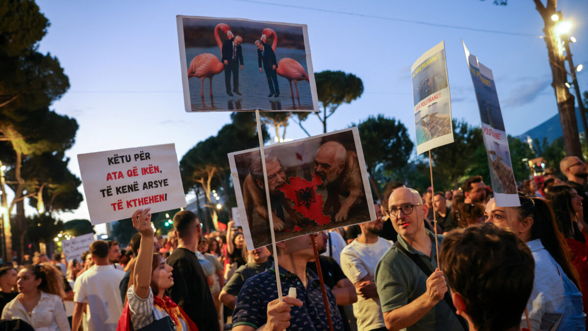 Protesters hold banners and placards during a protest against a luxury resort, a plan by a company linked to Donald Trump's son-in-law, Jared Kushner, on an environmentally sensitive part of the Adriatic coast, in Tirana, Albania, June 12, 2026. REUTERS/Valdrin Xhemaj