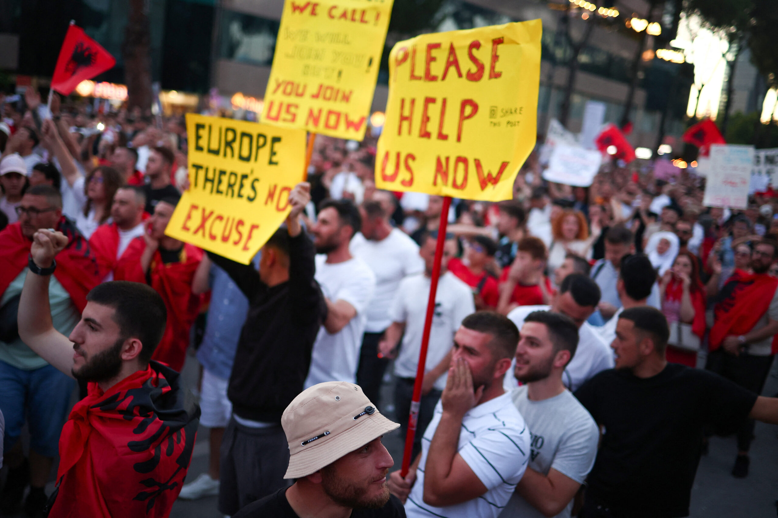 Protesters hold signs during a protest against a luxury resort, a plan by a company linked to Donald Trump's son-in-law, Jared Kushner, on an environmentally sensitive part of the Adriatic coast, in Tirana, Albania, June 12, 2026. REUTERS/Florion Goga