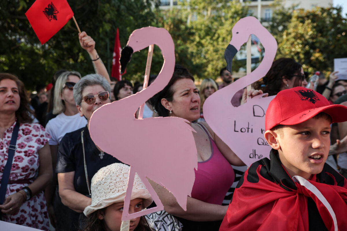 Members of the Albanian community and supporters hold cardboard-cut flamingos during a protest in solidarity with protesters in Albania against a development planned by a company linked to Donald Trump's son-in-law, Jared Kushner, on an environmentally sensitive part of the Adriatic coast, in Athens, Greece, June 6, 2026. REUTERS