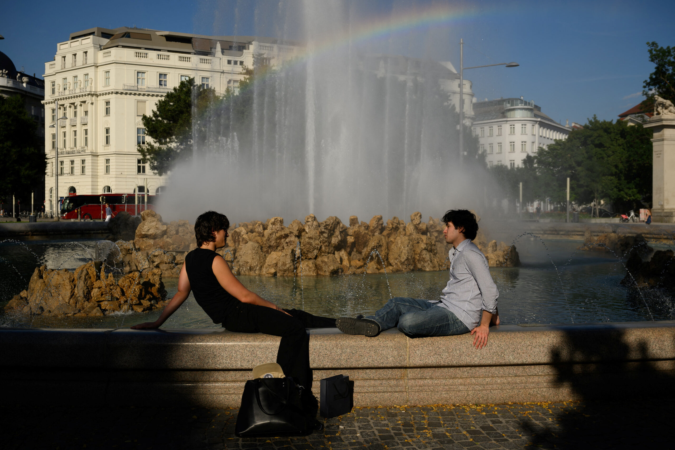 People rest in the city center during a heatwave in Vienna, Austria, June 18, 2026. REUTERS/Elisabeth Mandl
