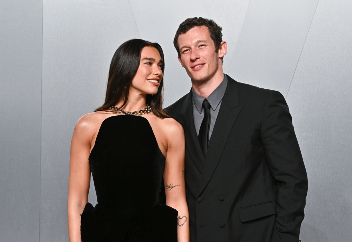 FILE - Dua Lipa, left, and Callum Turner arrive at the Vanity Fair Oscar Party on Sunday, March 15, 2026, at the Los Angeles County Museum of Art in Los Angeles.