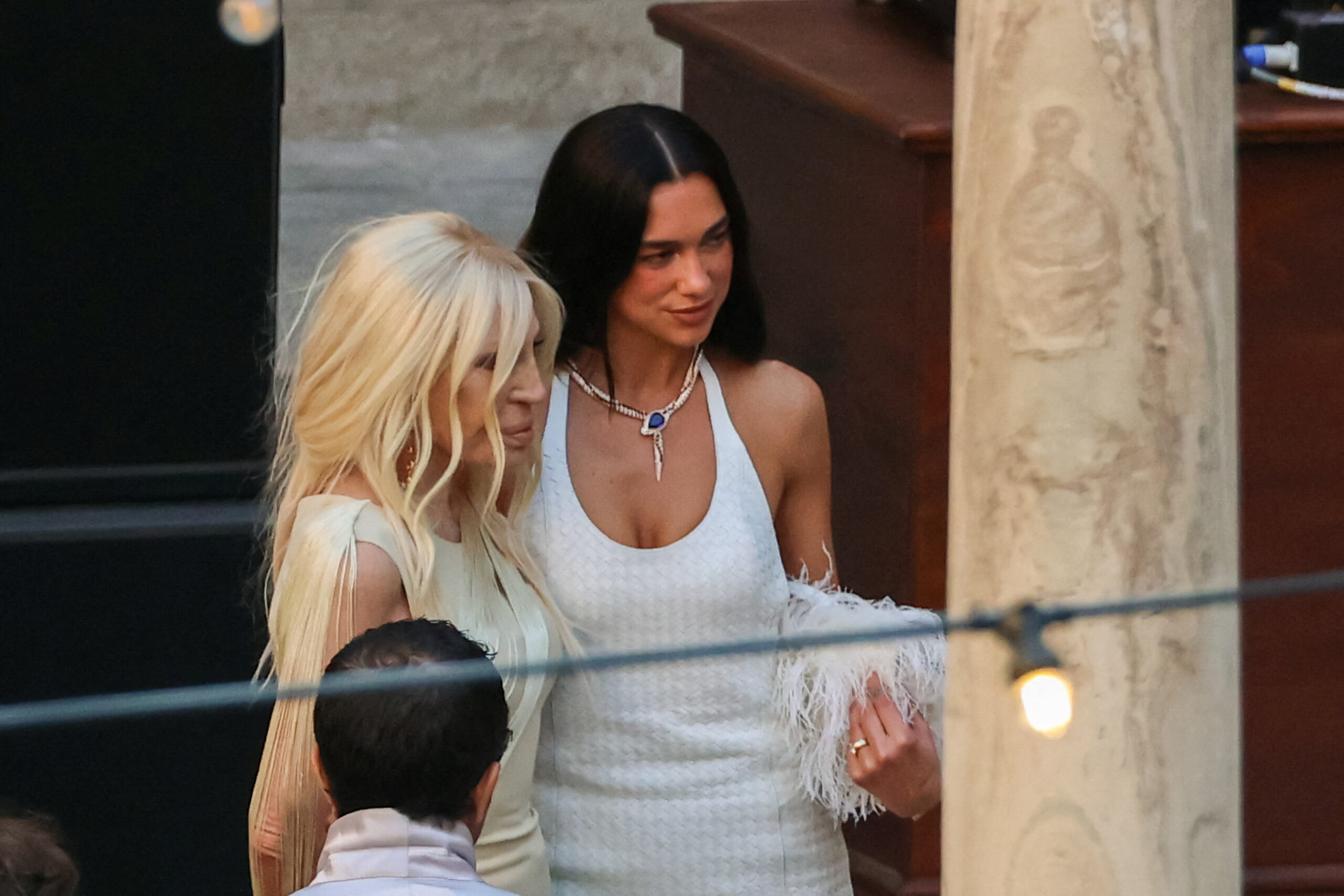 Singer Dua Lipa stands with designer Donatella Versace during wedding festivities following Lipa’s marriage to actor Callum Turner, in Palermo, Italy, June 5, 2026. REUTERS
