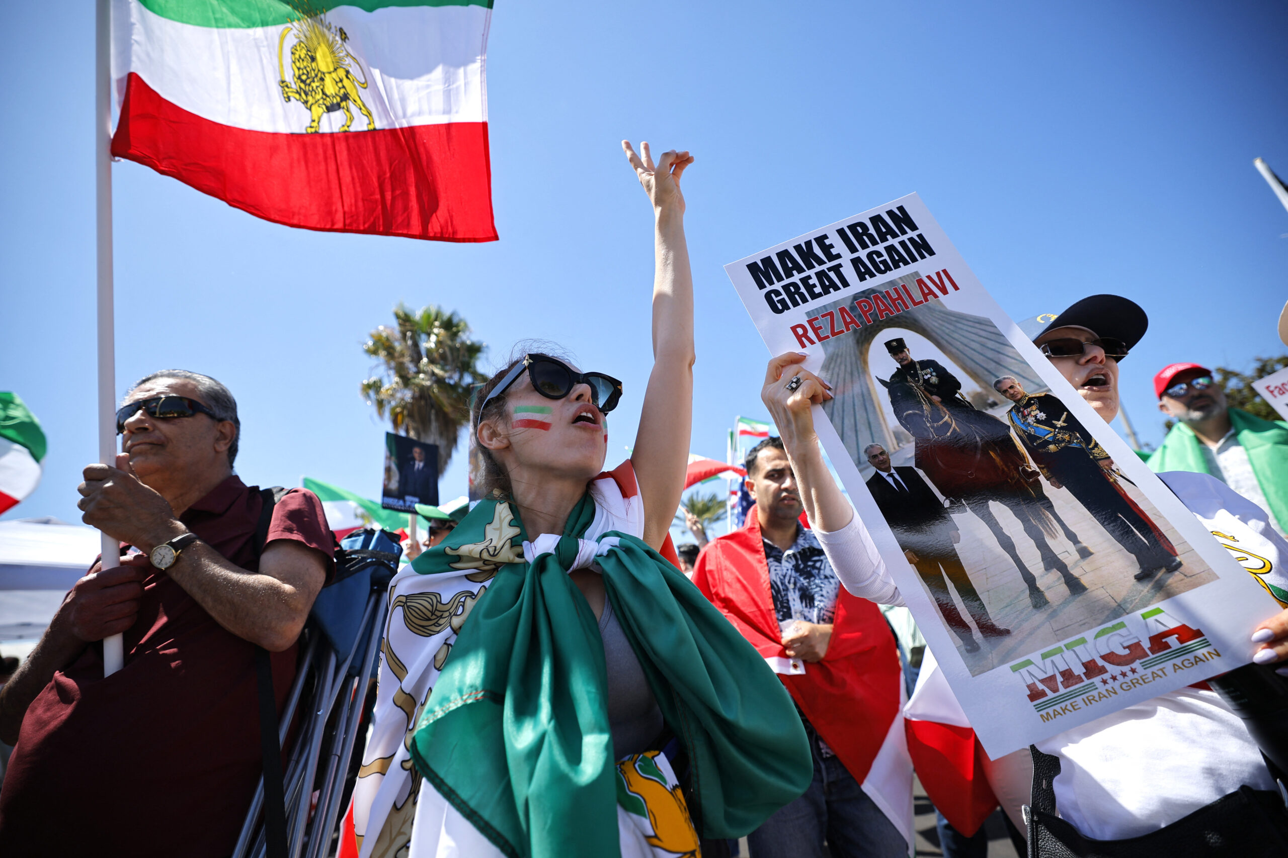 Soccer Football - FIFA World Cup 2026 - Group G - Iran v New Zealand - Los Angeles Stadium, Inglewood, California, U.S. - June 15, 2026 Protesters with Iran flags and banners of Iranian political activist Reza Pahlavi outside the stadium REUTERS
