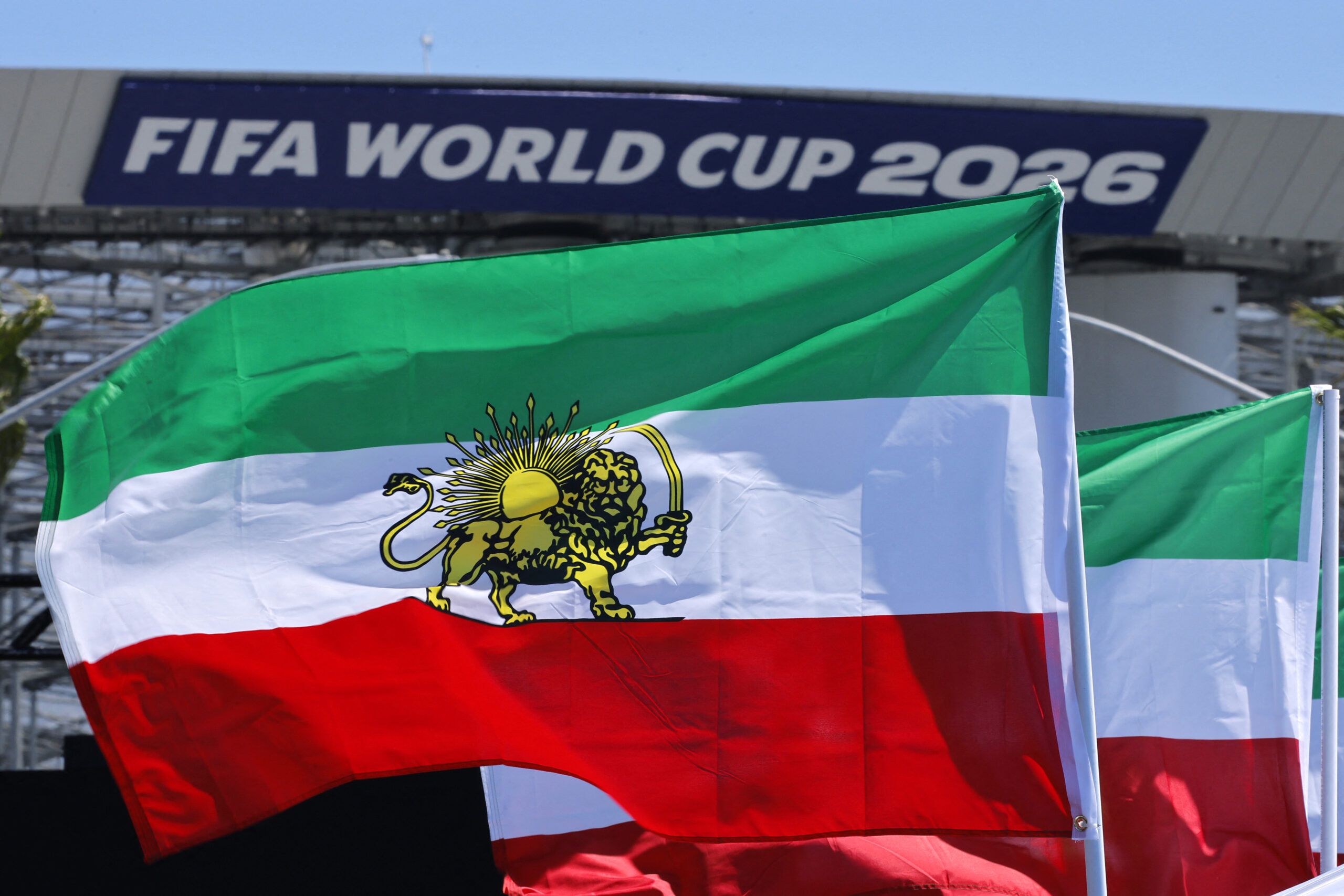 Soccer Football - FIFA World Cup 2026 - Group G - Iran v New Zealand - Los Angeles Stadium, Inglewood, California, U.S. - June 15, 2026 Iran flags are displayed during a protest outside the stadium before the match REUTERS