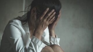 Young depressed woman, domestic and rape violence,beaten and raped sitting in the corner, Domestic violence.