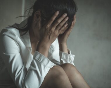 Young depressed woman, domestic and rape violence,beaten and raped sitting in the corner, Domestic violence.