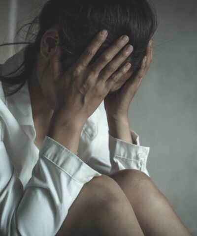 Young depressed woman, domestic and rape violence,beaten and raped sitting in the corner, Domestic violence.