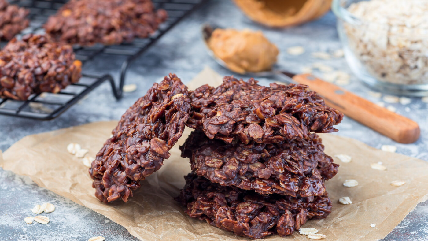 Flourless no bake peanut butter and oatmeal chocolate cookies on a parchment, horizontal