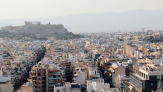 Partial view of Athens city with Acropolis hill in the background - Athens, Greece, June 13 2019.