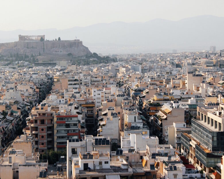 Partial view of Athens city with Acropolis hill in the background - Athens, Greece, June 13 2019.