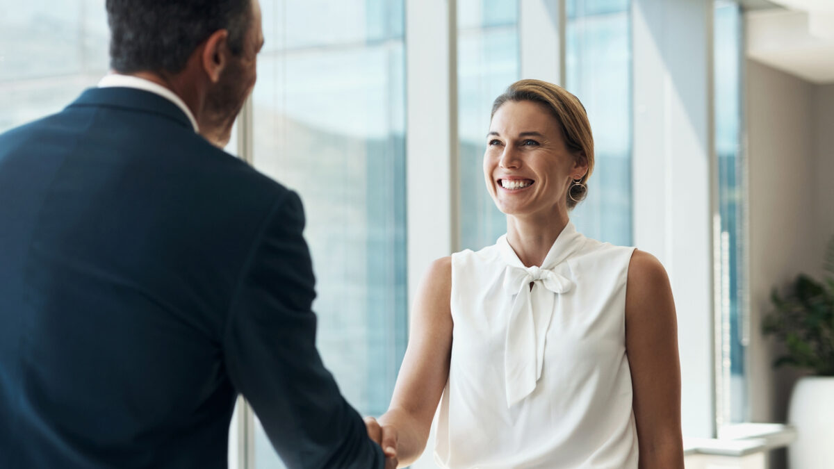 Handshake, meeting and business people partnership for b2b collaboration, onboarding welcome or professional opportunity. Corporate woman or clients shake hands for deal in office building interview