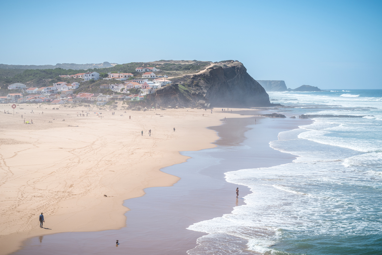 October 20, 2020 - Aljezur, Portugal: Tourists at Praia Monte Clerigo beach in Aljezur, Vicentine Coast, Algarve, in a sunny day. Portugal