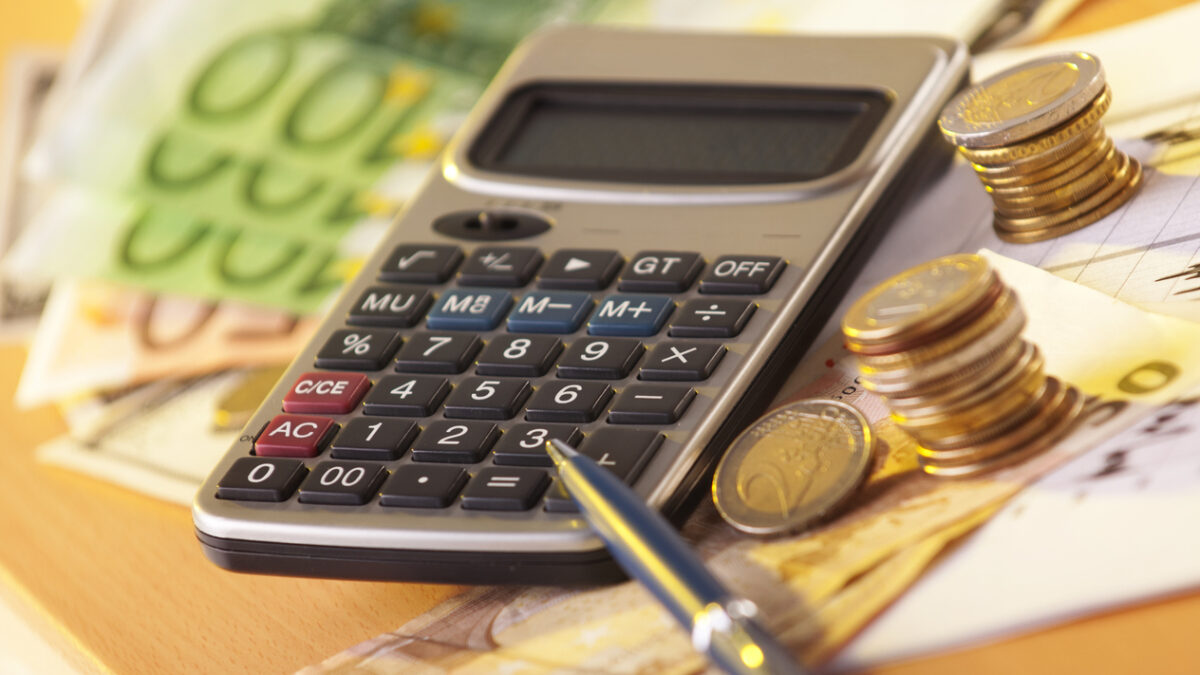European money on a table with calculator and coins, money and banking concept