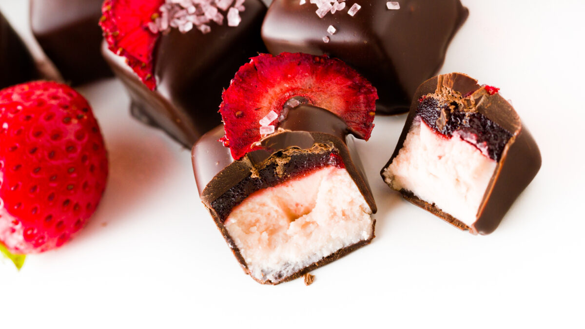 Strawberry daiquiri truffles on a white background.