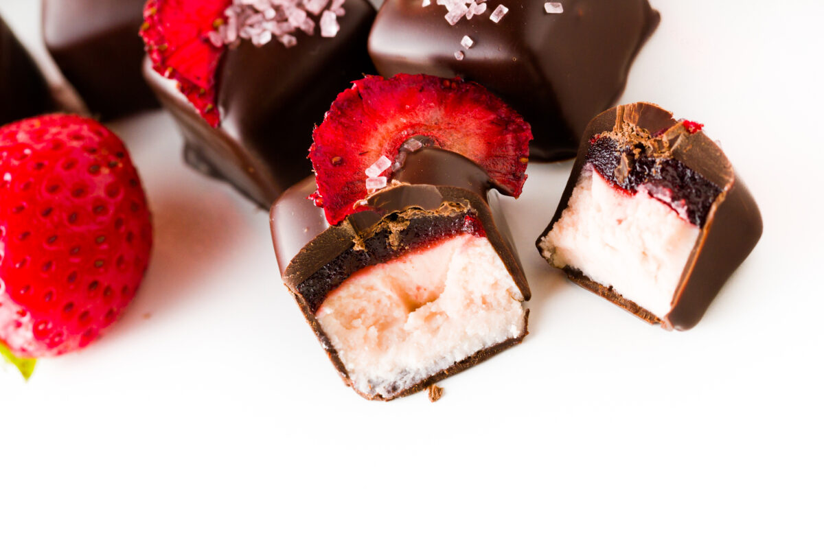 Strawberry daiquiri truffles on a white background.