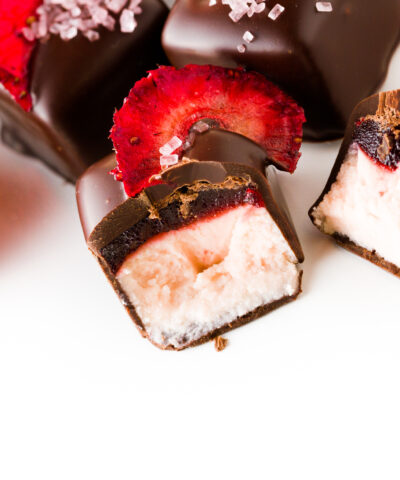 Strawberry daiquiri truffles on a white background.