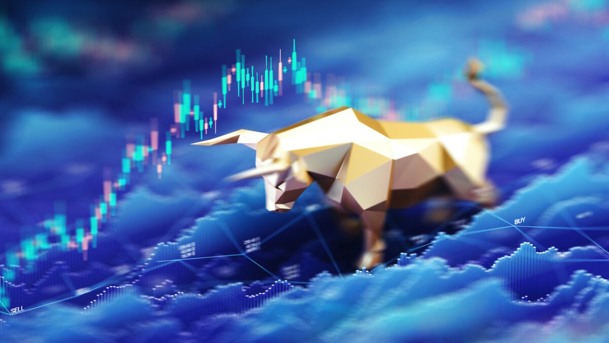 A stylized golden bull figurine stands prominently against a digital background of rising stock market charts and candlestick graphs, symbolizing bullish market trends, financial growth, and investor confidence. Ideal for illustrating economic optimism, stock trading, or market analysis