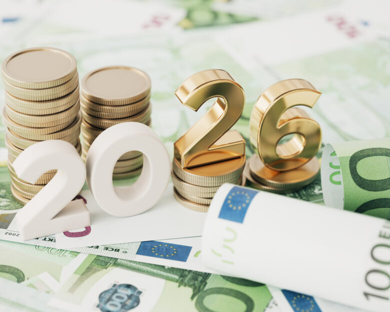 Gold Colored 2026 text and stack coin over 100 Euro Bills
