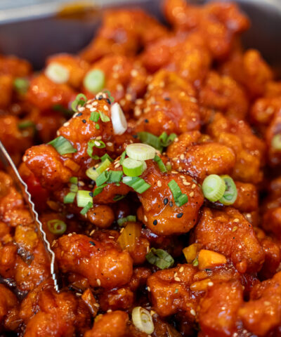 Close up of spicy glazed fried chicken in buffet tray.