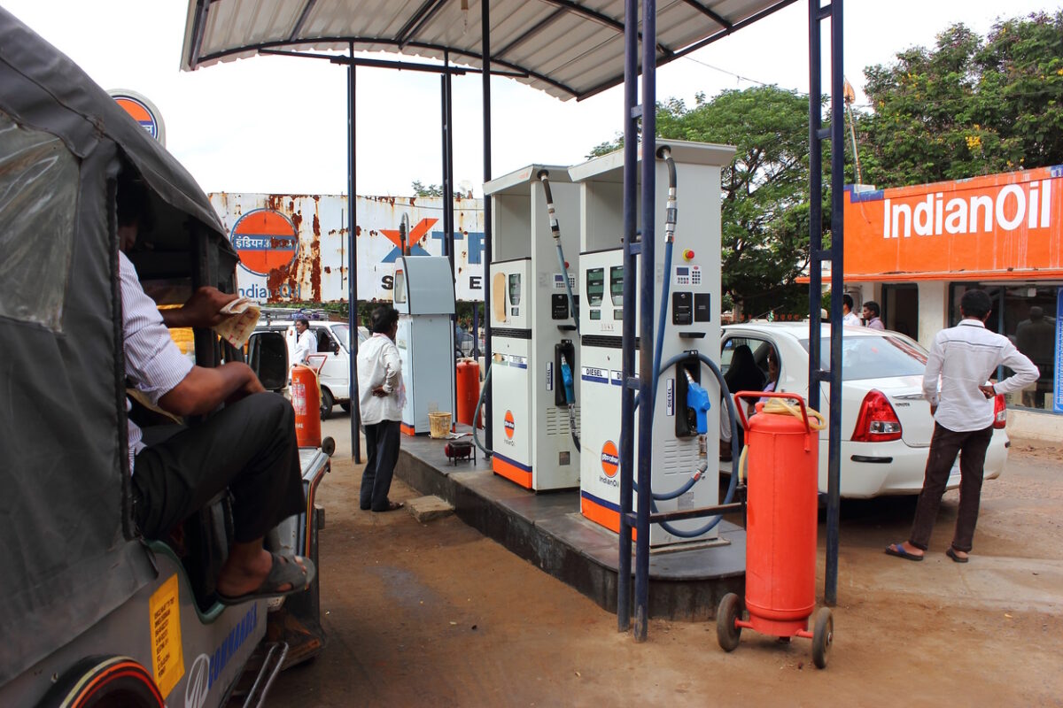 Srisailam, India - August 2, 2014: People buying petrol and diesel and getting their vehicles refueled at an Indian oil pump at Srisailam in Telangana state of India.
