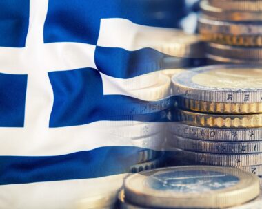Colorful waving greece flag on a euro money background