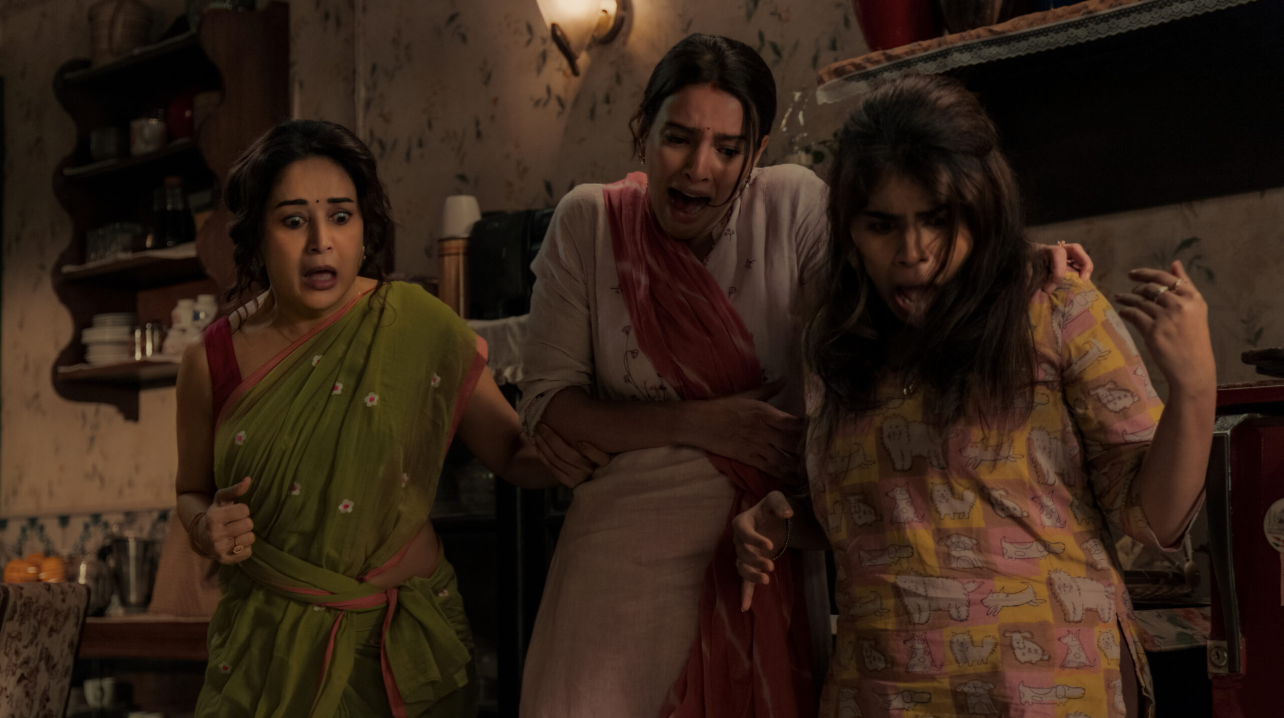 Maa Behen. (L to R) Madhuri Dixit as Rekha, Triptii Dimri as Jaya, Dharna Durga as Sushma in Maa Behen. Cr. Courtesy of Netflix © 2026