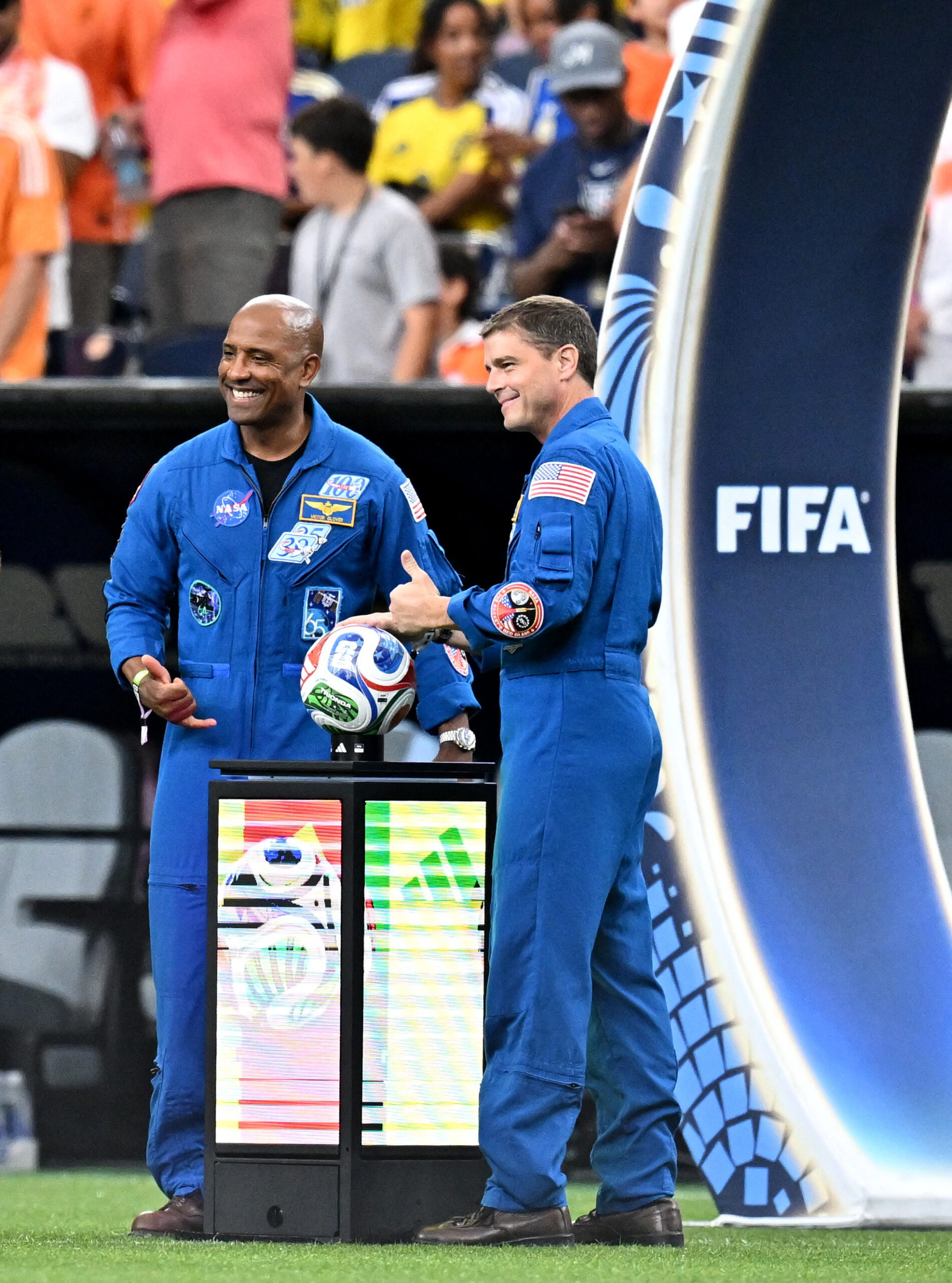 FIFA World Cup 2026 – Group F – Netherlands v Sweden Soccer Football - FIFA World Cup 2026 - Group F - Netherlands v Sweden - Houston Stadium, Houston, Texas, U.S. - June 20, 2026 Astronauts Reid Wiseman and Victor Glover on the pitch before the match IMAGN IMAGES via Reuters/Maria Lysaker