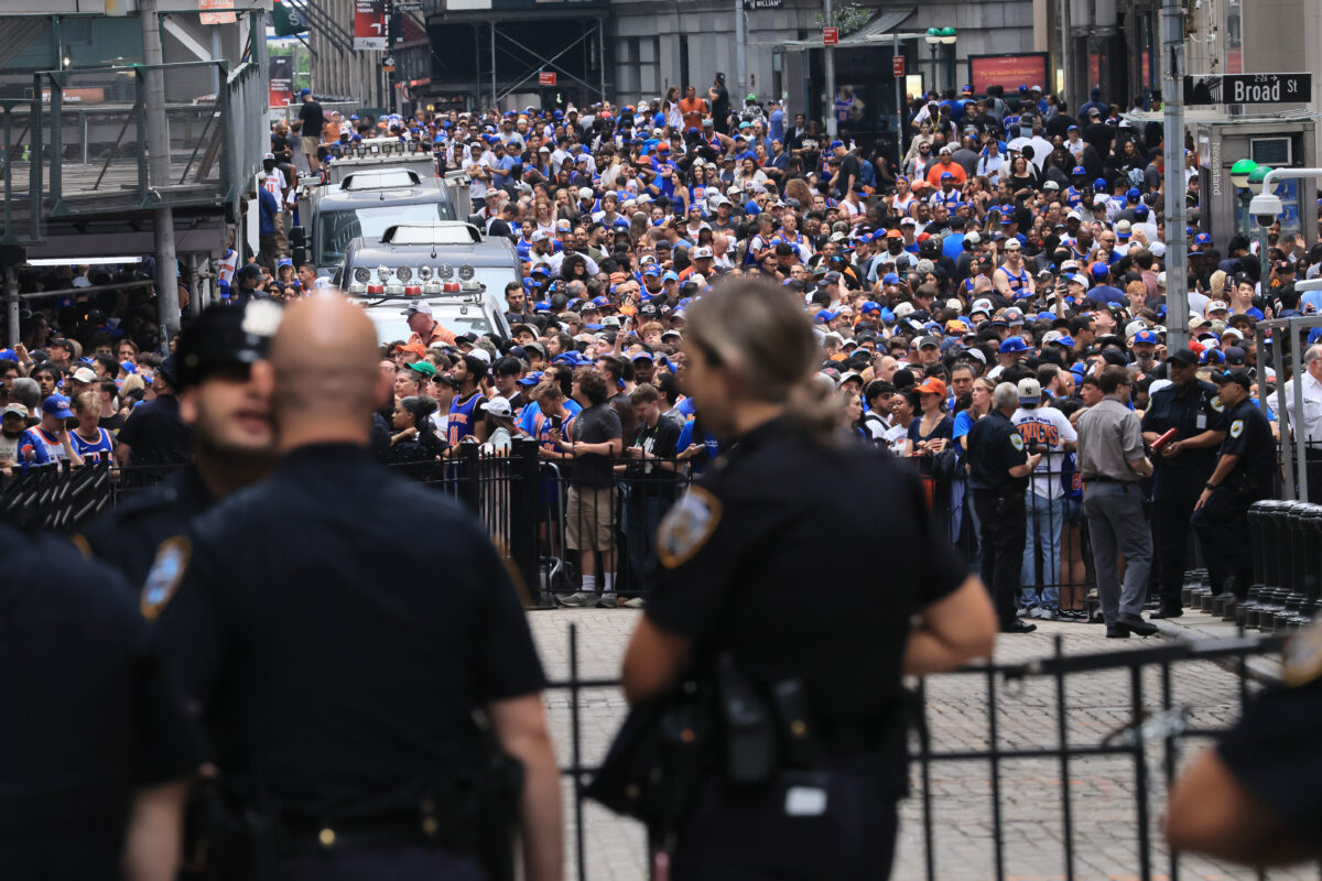 NEW YORK, NEW YORK - JUNE 18: Thousands of fans crowd into lower Manhattan near Wall Street before the New York Knicks Championship ticker tape parade and victory rally celebrating winning the 2026 NBA Finals on June 18, 2026 in New York City. The New York Knicks defeated the San Antonio Spurs in five games to win their first NBA Championship in 53 years. (Photo by Spencer Platt