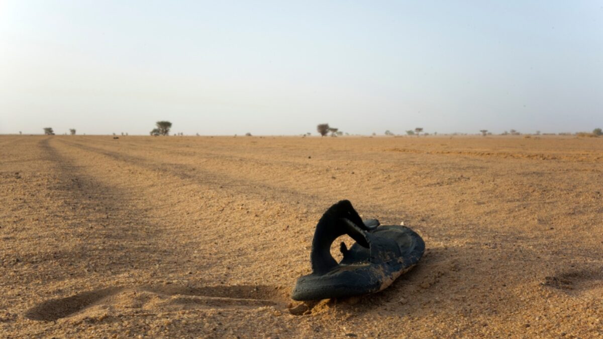 FILE - A sandal lies on the ground in Niger's desert region of the south central Sahara, Sunday, June 3, 2018.