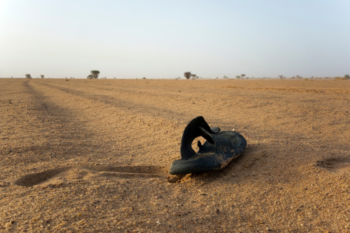 FILE - A sandal lies on the ground in Niger's desert region of the south central Sahara, Sunday, June 3, 2018.