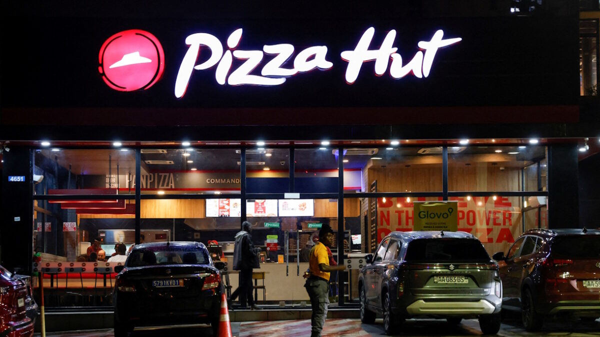 FILE PHOTO: A security guard stands in front of a Pizza Hut fast food restaurant in Abidjan, Ivory Coast October 5, 2024.