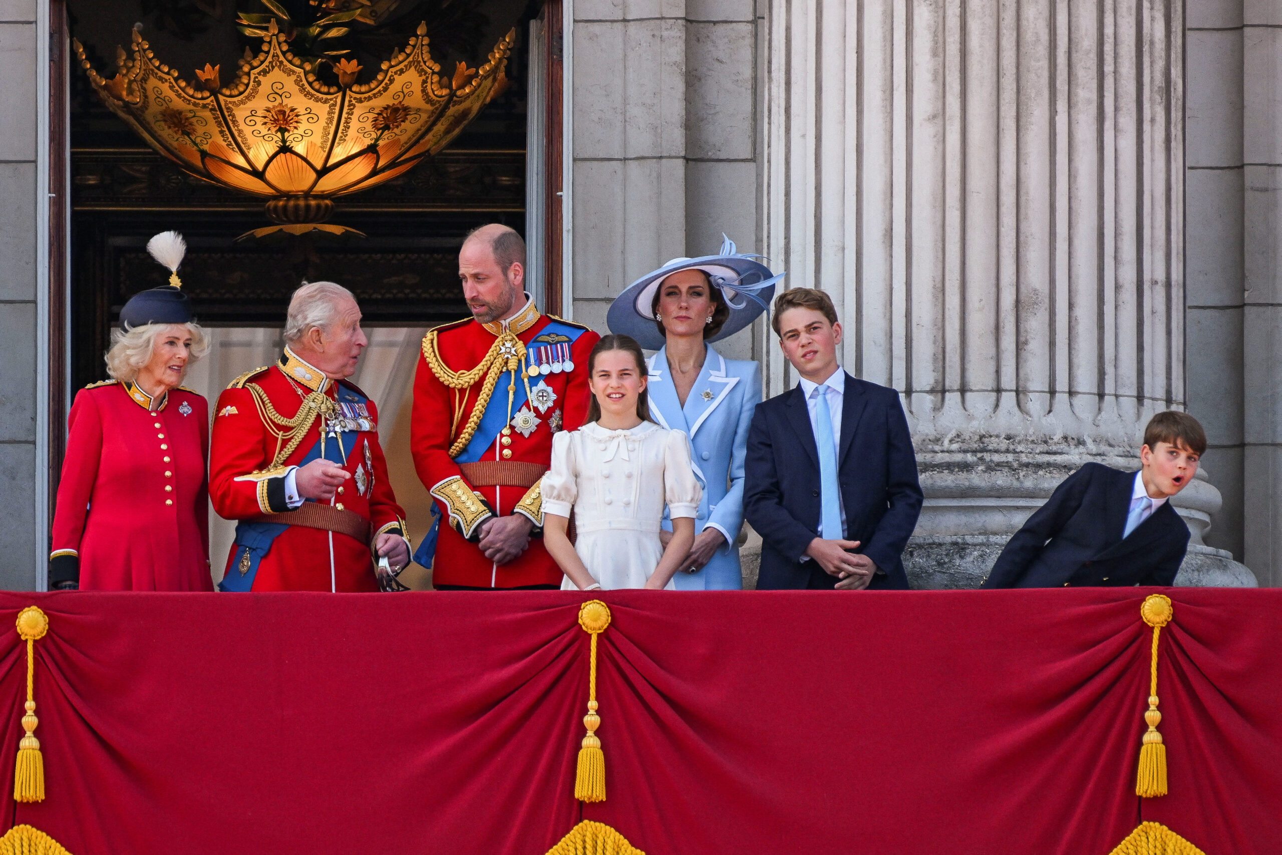 Britain's King Charles, Queen Camilla, Prince William, Kate, Princess of Wales, Prince George, Princess Charlotte and Prince Louis appear on the balcony of Buckingham Palace during the Trooping the Colour parade to honour Britain's King Charles, as part of the official birthday celebrations, in London, Britain, June 13, 2026. REUTERS/Chris J. Ratcliffe