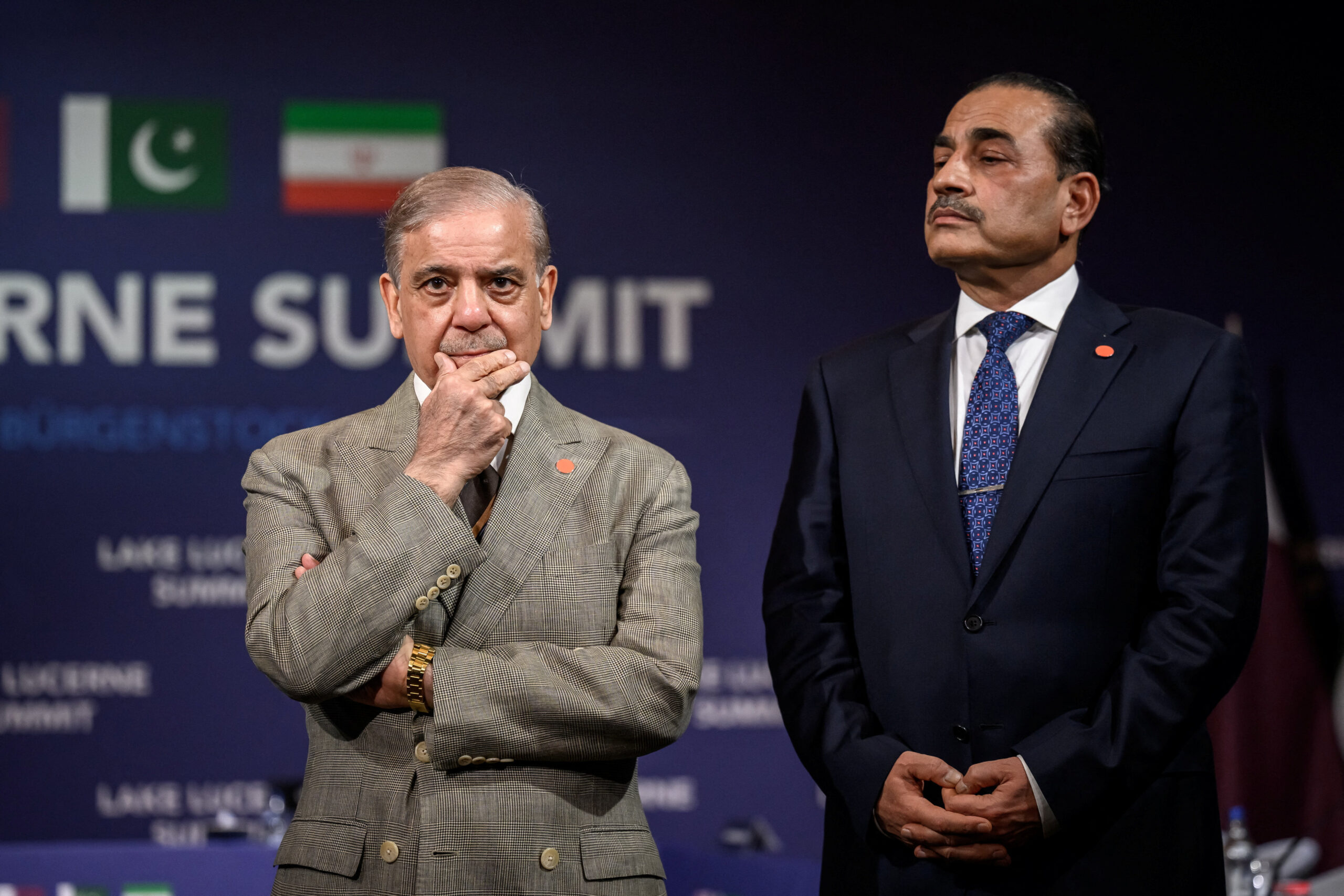 Pakistan's Prime Minister Shehbaz Sharif stands with Pakistan's Chief of Army Staff Field Marshal Asim Munir prior to a quadrilateral meeting between the United States, Iran, Pakistan and Qatar at the Burgenstock luxury hotel complex overlooking Lake Lucerne, Switzerland, on June 21, 2026. FABRICE COFFRINI/Pool via REUTERS