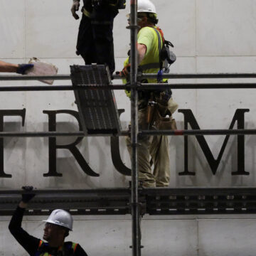 Workers prepare scaffolding ahead of removing lettering from the facade of the John F. Kennedy Memorial Center for the Performing Arts, following a federal judge’s order to remove U.S. President Donald Trump's name from the institution, in Washington, D.C., U.S., June 13, 2026. REUTERS/Jonathan Ernst
