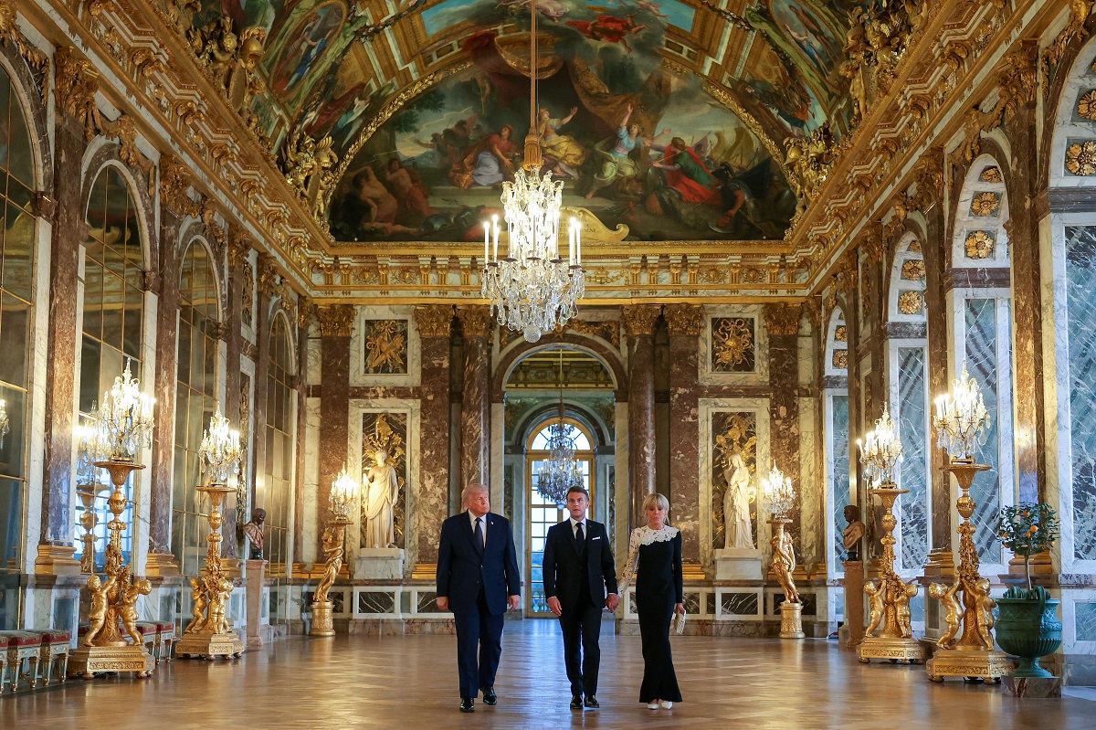 U.S. President Donald Trump receives a tour of Chateau de Versailles from President of France Emmanuel Macron and his wife Brigitte Macron ahead of a dinner, France, June 17, 2026. Anna Moneymaker