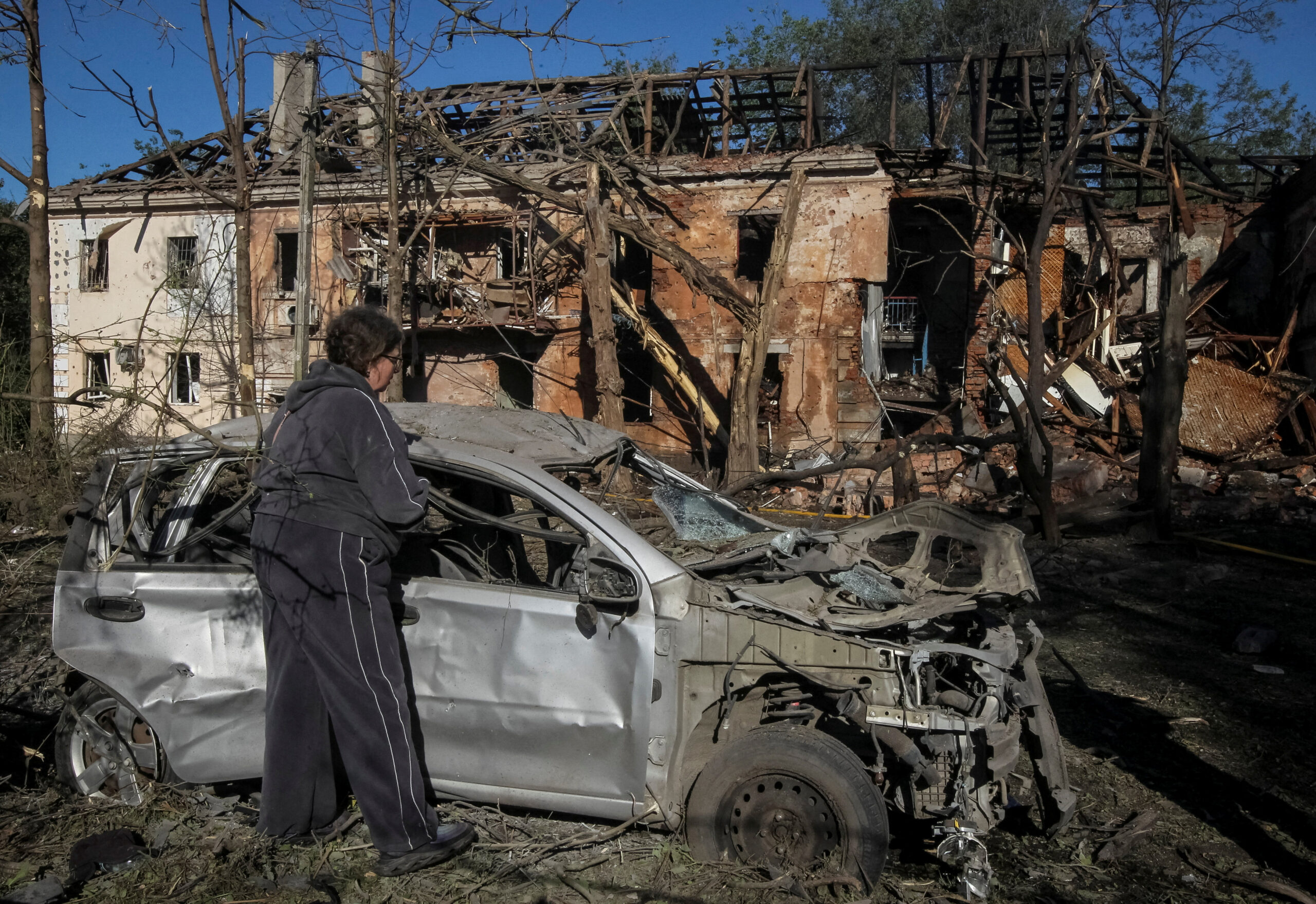 A resident inspects a destroyed car at a site of a Russian drone and missile strike, amid Russia's attack on Ukraine, in Dnipro, Ukraine June 2, 2026. REUTERS/Stringer TPX IMAGES OF THE DAY