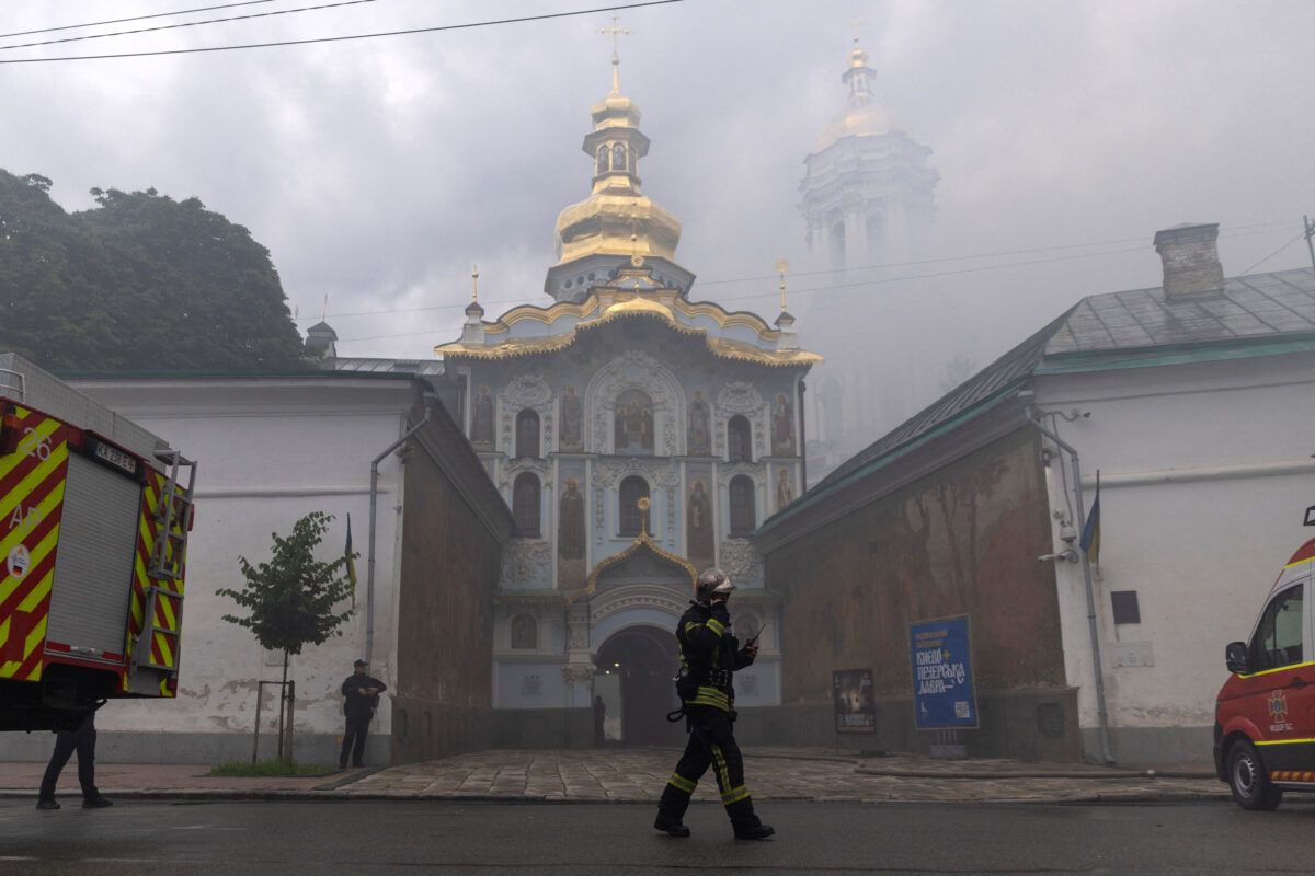 An emergency worker walks in front of Kyiv Pechersk Lavra, after it was hit during Russian missile and drone strikes, amid Russia's attack on Ukraine, in Kyiv, Ukraine June 15, 2026. REUTERS/Thomas Peter