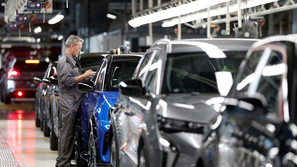 An employee works at the automotive assembly line for the electric Renault R5 E-Tech car at the Renault factory of the Ampere ElectriCity site in Douai, France, July 15, 2026.