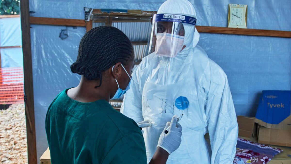 Health workers interact at the Evangelical Medical Center, in Bunia, eastern Congo, Friday, July 3, 2026, where Ebola clinical trials are scheduled to take place. (AP Photo/Dirole Lotsima Dieudonne)