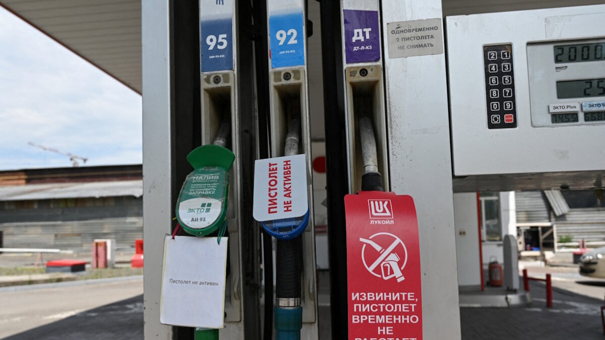 FILE PHOTO: Signs inform of non-working fuel pump nozzles at a petrol station, as according to local officials some regional filling stations face gasoline shortages due to production cuts at major refineries, amid the Russia-Ukraine conflict in Rostov-on-Don, Russia, June 23, 2026. REUTERS/Sergey Pivovarov/File Photo