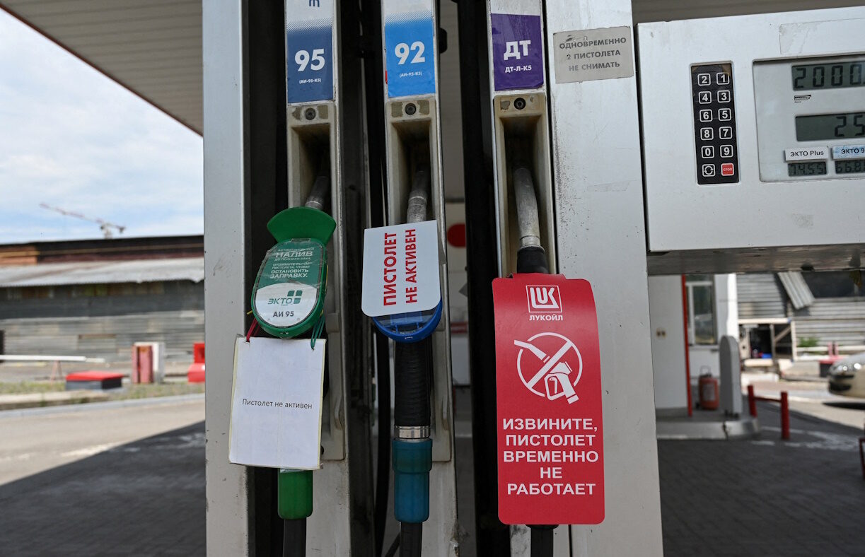 FILE PHOTO: Signs inform of non-working fuel pump nozzles at a petrol station, as according to local officials some regional filling stations face gasoline shortages due to production cuts at major refineries, amid the Russia-Ukraine conflict in Rostov-on-Don, Russia, June 23, 2026. REUTERS/Sergey Pivovarov/File Photo